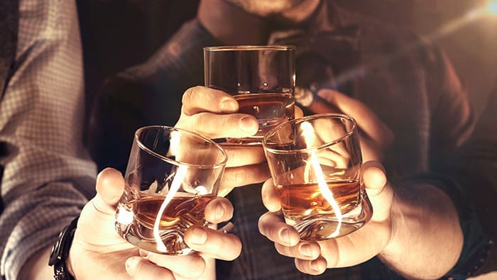 toasting with whisky
