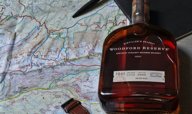 Bottle of Woodford Reserve and on a map, to better study what was the whiskey rebellion