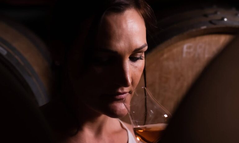 Woman smelling one of the best whisky in the world