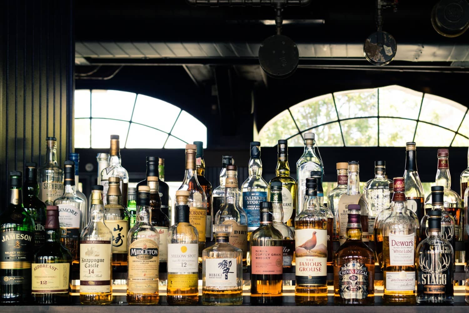 Several kinds of whisky in display to enumerate the difference between Scotch and other Whisky