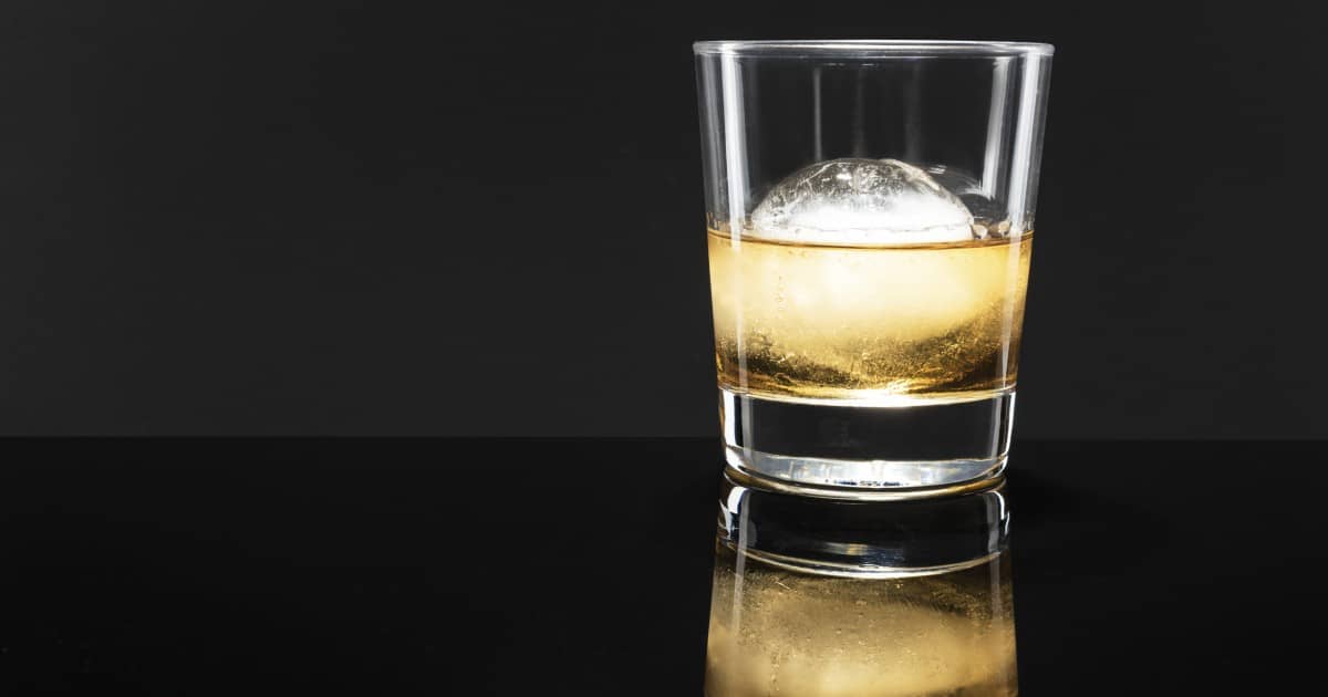 Narrow whisky glass with a big ice sphere to avoid dilluting.