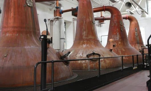 copper pot still in a whisky distillery